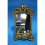 An Art Nouveau style gilt easel mirror.