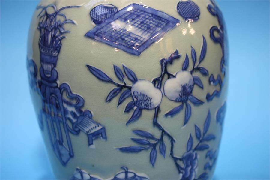 A late 19th century Chinese Celadon vase, decorated in blue relief. 41 cm high - Image 3 of 9