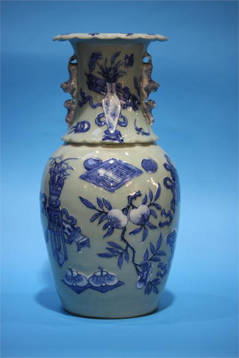 A late 19th century Chinese Celadon vase, decorated in blue relief. 41 cm high