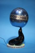 A 'Guinness is Good for You' seal table lamp with blue metallic spherical shade, printed marks to