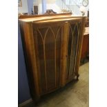 A walnut china cabinet.