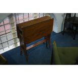 An Edwardian mahogany drop flap Sutherland table.