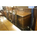 A heavily carved oak sideboard.