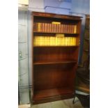 A reproduction mahogany bookcase. 100 cm long