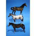 Three Beswick horses.