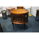 A reproduction mahogany oval display cabinet.