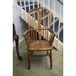 A high back Windsor chair.