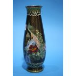 A tall tapering Cloissone vase, decorated with Peacocks. 25.5 cm high