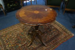 A reproduction mahogany circular centre table.