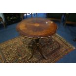 A reproduction mahogany circular centre table.