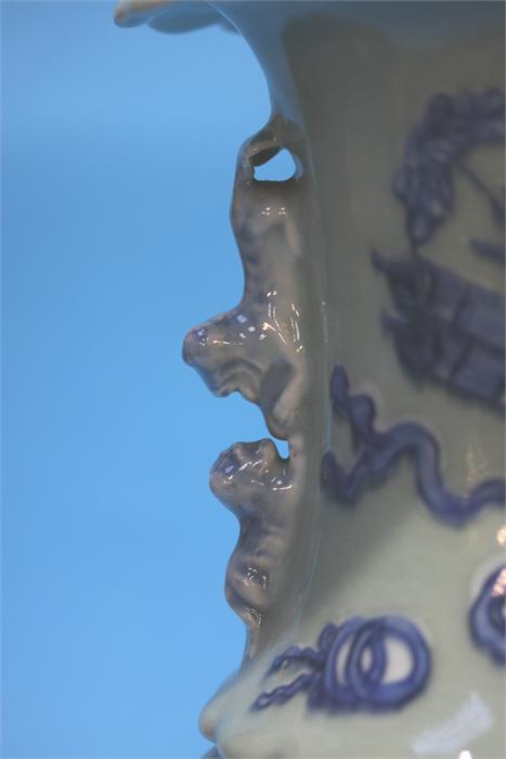 A late 19th century Chinese Celadon vase, decorated in blue relief. 41 cm high - Image 7 of 9