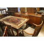 A Youngers teak dining room suite comprising; sideboard, drawer leaf table and six chairs.