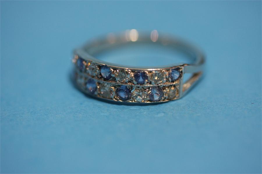 An Antique platinum sapphire and diamond ring.