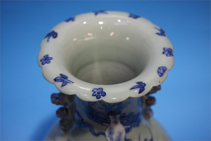 A late 19th century Chinese Celadon vase, decorated in blue relief. 41 cm high - Image 2 of 9