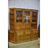 A three section Ercol display cabinet.