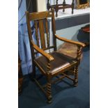 An oak barley twist carver chair.