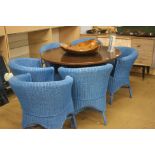 A set of six blue Lloyd Loom style chairs.
