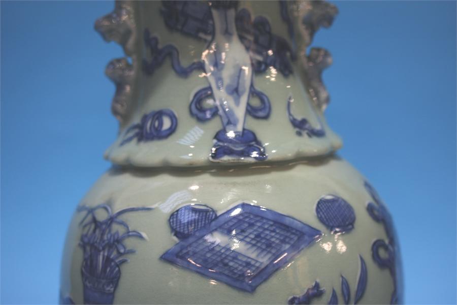 A late 19th century Chinese Celadon vase, decorated in blue relief. 41 cm high - Image 4 of 9