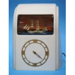 A white Bakelite cased Vitascope clock, labelled 'Vitascope Industries Ltd'.