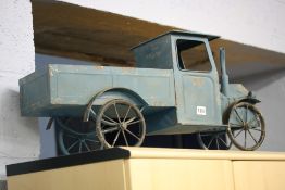 A blue vintage style truck.