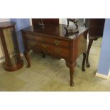 An oak Lowboy with two short and one long drawer.