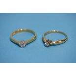 Two 18ct solitaire diamond rings.