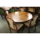 A Danish Skovby circular extending dining table and four Bendixen chairs.