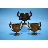 A set of three Victorian bronze urns/vases in the Classical style. Provenance: Purchased in Scotland