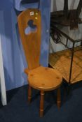 A small oak milking chair.