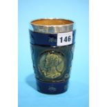 A silver mounted Royal Doulton beaker.