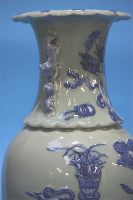 A late 19th century Chinese Celadon vase, decorated in blue relief. 41 cm high - Image 5 of 9