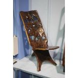 Carved African style hardwood chair