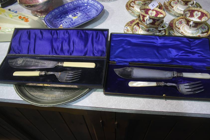 Two cased fish servers etc.