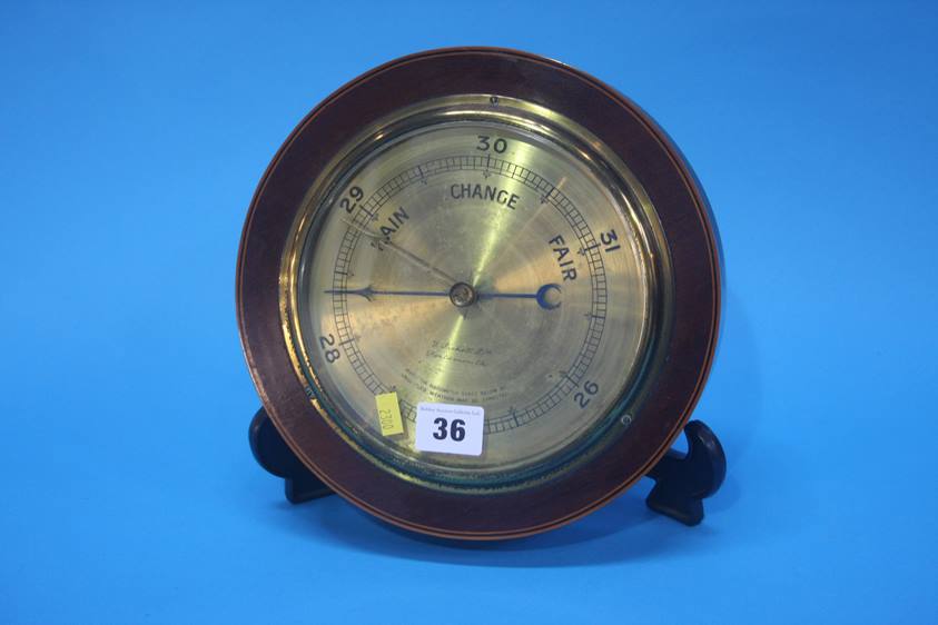 A mahogany cased barometer, the brass face signed