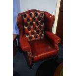 A Chesterfield red leather high back armchair