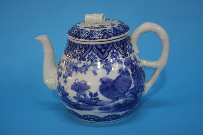 An Oriental blue and white tea pot