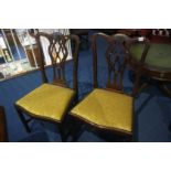 A set of four single mahogany dining chairs