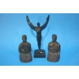 A reproduction decorative bronze figure and a pair of Charles Lindbergh bookends