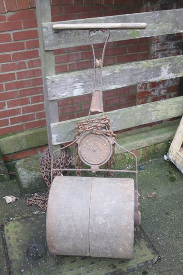 A cast iron garden roller