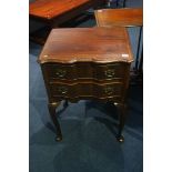 A good quality serpentine fronted two drawer side table, with carved shelf to the knee, supported on