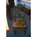 A carved oak hall chair