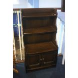 An oak Ercol waterfall bookcase