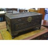 A small Oriental carved Camphorwood chest, 69cm wide