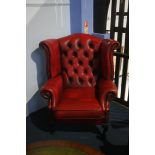 A Chesterfield red leather high back armchair