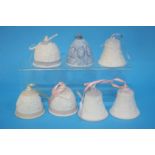 A collection of seven Lladro bells