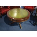 A reproduction mahogany drum table