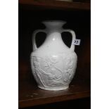 Two handled vase embossed with Classical scene