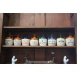 Eight various stone-ware Whisky jars