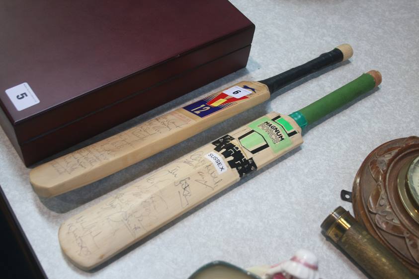 Two signed cricket bats