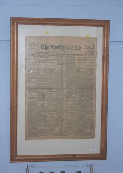 A framed copy of The Northern Echo and a model of The Titanic